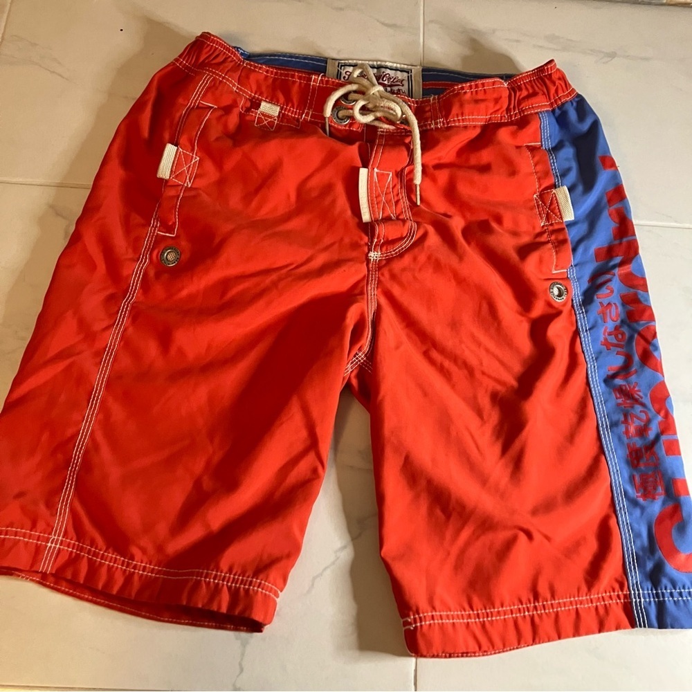 Superdry red / blue swim shorts.  Lined. Velcro pockets.  EUC!